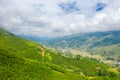 The traditional village on the mountainsides with tropical forests with green and yellow rice terraces, in Asia, Vietnam, Tonkin,