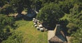 Traditional village with ornately carved roofs houses aerial view. Unique architecture landmark