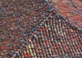 Traditional village tiled roof. Textured colorful close up rustic architectural detail
