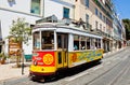 Traditional vintage Lisbon yellow tram decorated with sardines