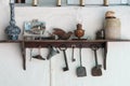 Traditional vintage metal cyprus tools and handcrafted objects hanging on white wall Royalty Free Stock Photo