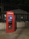 Traditional vintage red K6 telephone kiosk in front of the British Museum