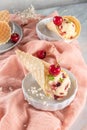 Traditional waffle cones with ice cream and cherry fruits on marble stone surface Royalty Free Stock Photo