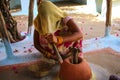 Traditional way of grinding grain in a rural village,near Khajuraho,India