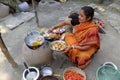 Traditional way of making food on open fire in a village, Kumrokhali, West Bengal, India