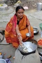 Traditional way of making food on open fire in a village, Kumrokhali, West Bengal, India Royalty Free Stock Photo