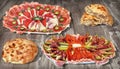 Traditional Welcome Appetizer Savory Dishes Meze with Pita Flatbread Loaves on Old Weathered Cracked Pinewood Grunge Backdrop Royalty Free Stock Photo