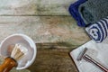 Traditional wet shaving supplies in rustic wooden table. Retro safety razor and lathered shaving brush. With copy space.