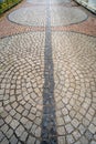 Traditional wet stone pavement in perspective after the rain Royalty Free Stock Photo