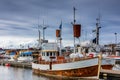 Traditional whale watching boats lying in the harbor of Husavik