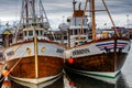 Traditional whale watching boats lying in the harbor of Husavik