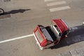 A traditional 3-wheeled Piaggio Ape taxi parked in the center of Palermo, Sicily