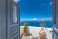 Romantic scene in Santorini, wooden door open with blue sea and sunny sky. Summer love couple destination Royalty Free Stock Photo