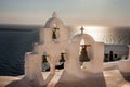 Traditional white bell tower at Oia Royalty Free Stock Photo