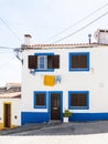 Traditional white and blue stone house with tiled roof Royalty Free Stock Photo