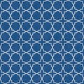 Traditional white quatrefoil lattice design on watercolor style textured blue background. Seamless vector pattern Royalty Free Stock Photo