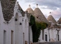 Traditional white-washed conical-roofed houses in the Rione Monti area of the town of Alberobello in Puglia, south Italy