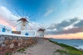 Traditional white windmills at sunrise, Mykonos, Greece Royalty Free Stock Photo