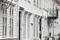 Traditional white wooden norwegian buildings facades in Bergen.