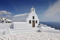 Traditional whitewashed Greek church overlooking Aegean Sea, Oia village, Santorini island, Cyclades, Greece, Europe Royalty Free Stock Photo