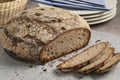 Traditional whole Bauernkloben brot and slices close up