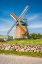 Traditional windmill with blue sky and clouds