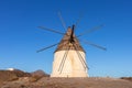 Traditional windmill in the countryside, old mill used to grind wheat flour or other raw materials using the wind energy. Royalty Free Stock Photo