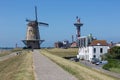 Dutch traditional windmill at dike near city Vlissingen