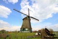 Traditional windmill in dutch landscape Royalty Free Stock Photo