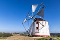 Traditional windmill in the hills of Portugal Royalty Free Stock Photo