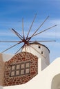 Traditional windmill in Oia village on Santorini Island, Cyclades, Greece Royalty Free Stock Photo