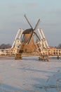 Traditional windmill and open drawbridge, Kinderdijk, Netherlands Royalty Free Stock Photo