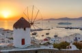 Traditional windmill over Mykonos Town at sunset Royalty Free Stock Photo