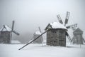 traditional windmills buildings in deep snow