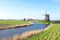 Traditional windmills in a dutch landscape in Netherlands Royalty Free Stock Photo