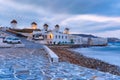 Traditional windmills at sunrise in Mykonos, Greece Royalty Free Stock Photo