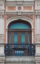 Old brick ornament window and balcony spanish style with stucco decoration Royalty Free Stock Photo