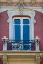 Red brick traditional window and balcony in Spain with stucco decoration Royalty Free Stock Photo