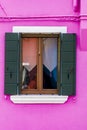 Traditional window on the colorful facade of building in Burano island, Italy Royalty Free Stock Photo