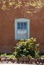 A traditional window on the exterior of an adobe style building in Santa Fe, New Mexico Royalty Free Stock Photo