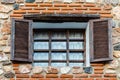 Traditional window with wooden shutters