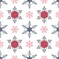 Traditional winter seamless pattern of red and gray snowflakes on white background Royalty Free Stock Photo