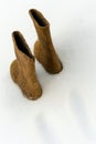 Traditional winter shoes felt boots on white snow Royalty Free Stock Photo