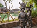 Traditional woman statue in fenghuang old town .