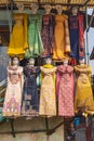 Traditional women\'s clothes for sale at a market in Srinagar