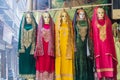 Traditional women\'s clothes for sale at a market in Srinagar