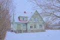 traditional woodem house in the snow in Rakvere Royalty Free Stock Photo
