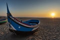 Traditional wooden boat on the beach at Nazare, Portugal.