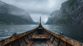 Traditional wooden boat on a misty fjord