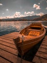Traditional wooden boat Pletna on the backgorund of Church on the Island on Lake Bled, Slovenia. Europe Royalty Free Stock Photo